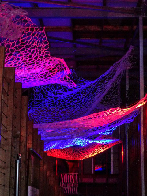 ‘Ebb and Flow’ lit in red and pink – recycled plastic – 20m long x 5m wide – variable